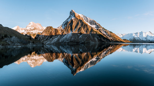 Mountain on with a lake nearby.